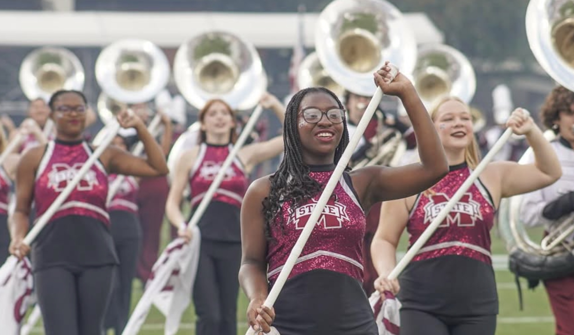 Members of the MSU Color Guard march in formation during the pregame show